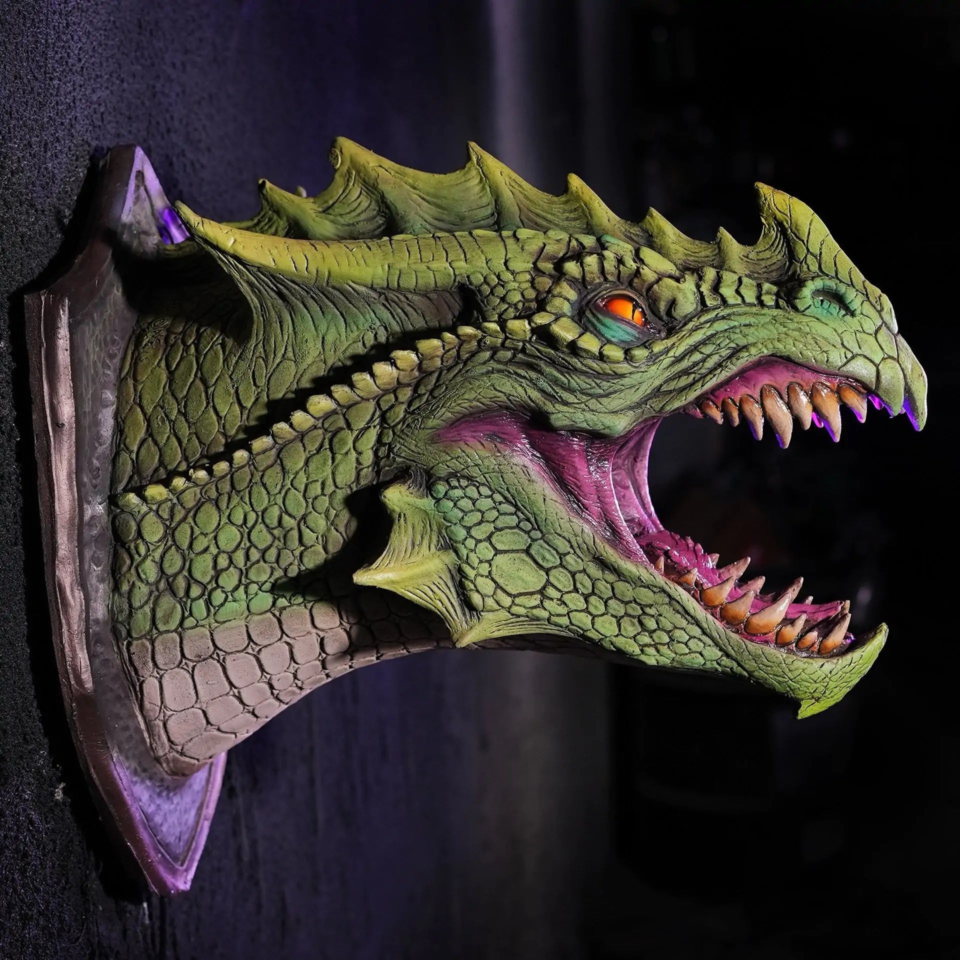 a green dragon head mounted on a wall