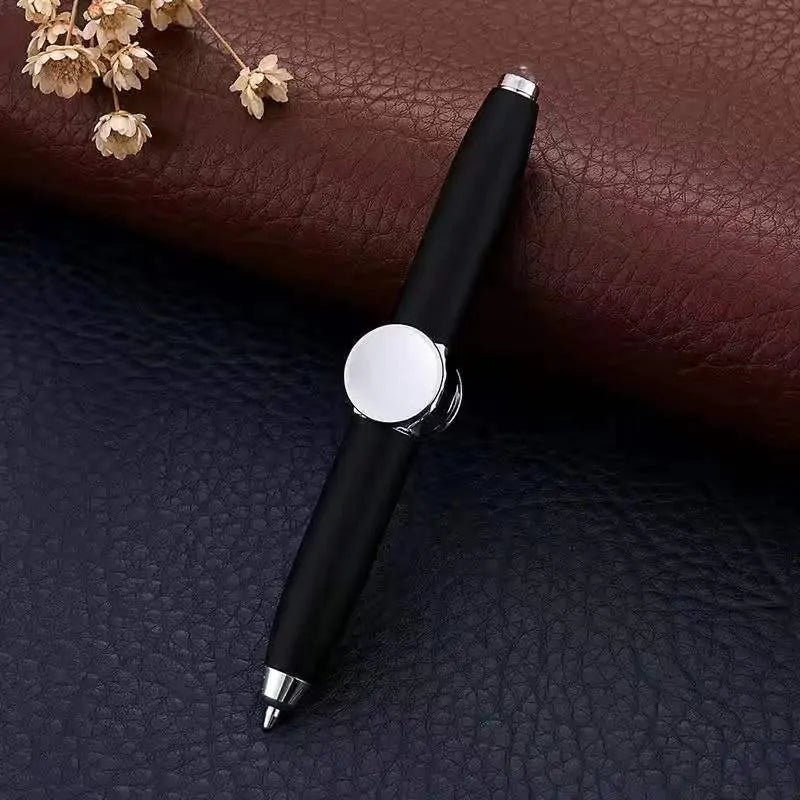 a pen sitting on top of a leather surface