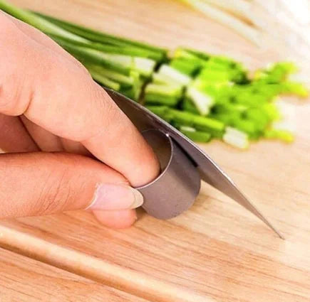 a person is cutting up some vegetables on a cutting board