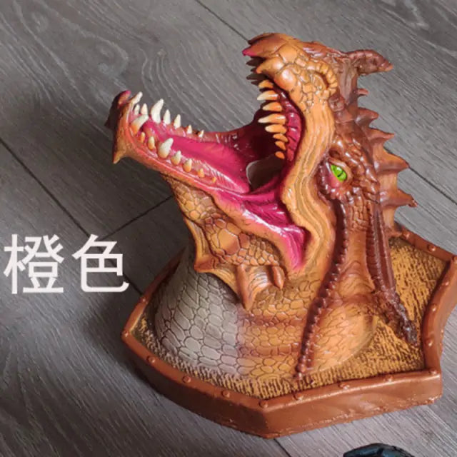 a toy of a dragon head on a table
