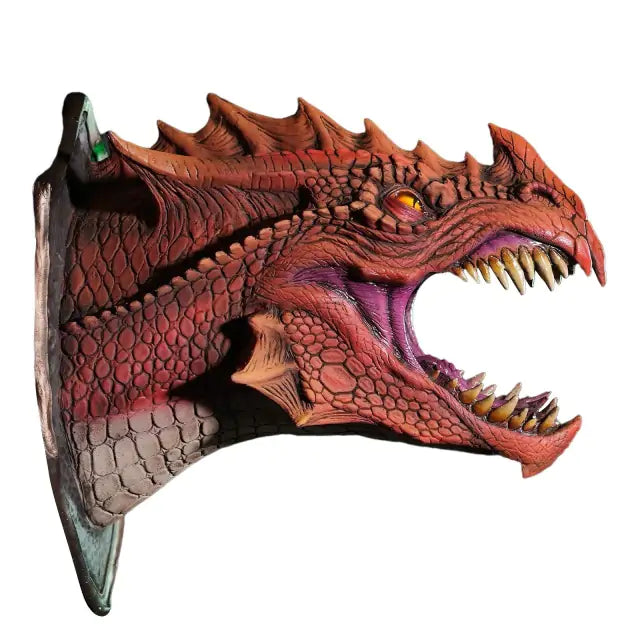 a red and black dragon mask on a white background