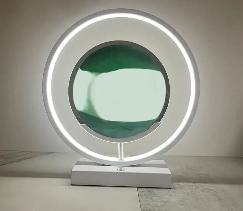 a round mirror sitting on top of a white table