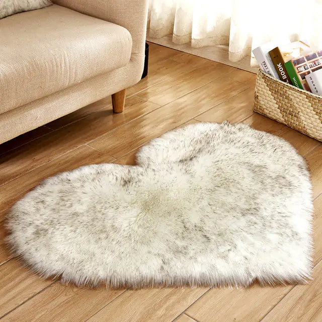 a heart shaped rug on the floor of a living room