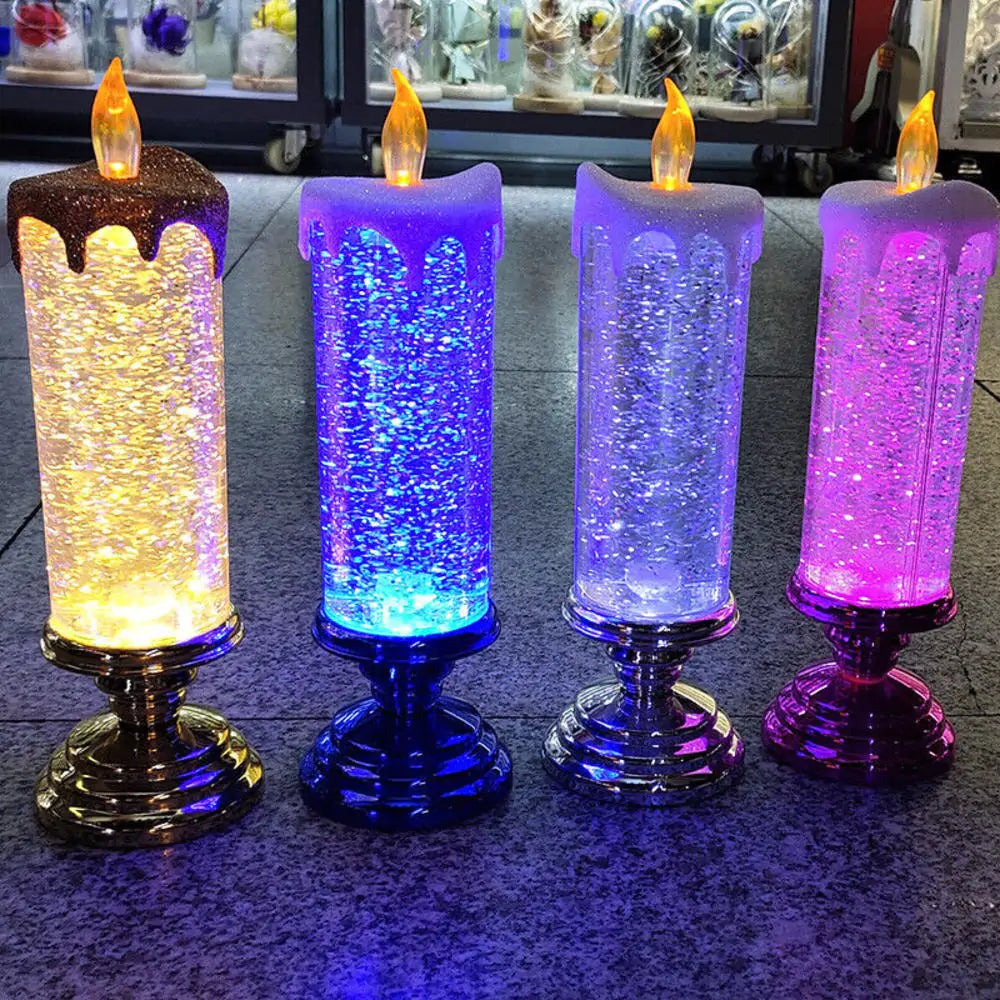 a group of three lit candles sitting on top of a table