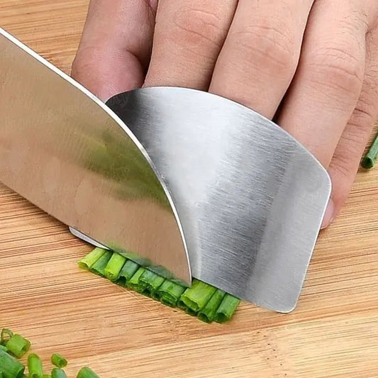 a person cutting celery with a knife on a cutting board
