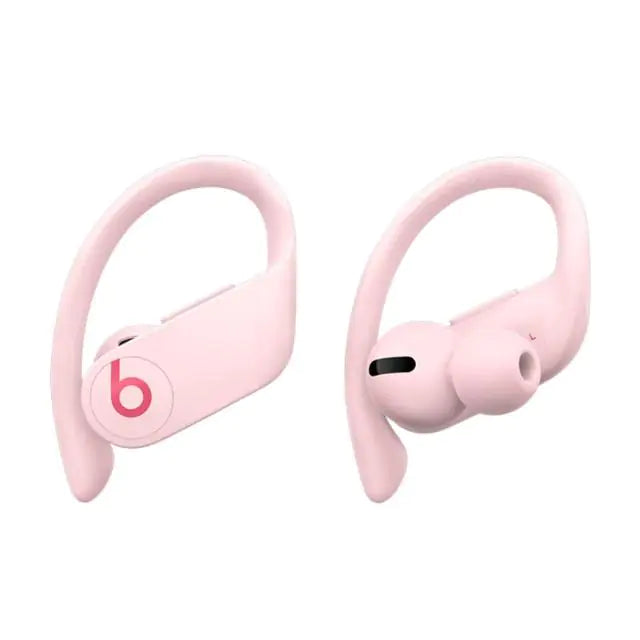 a pair of pink earphones sitting next to each other