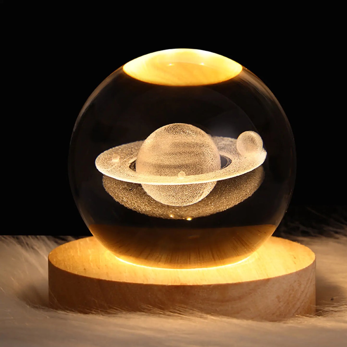 a glass ball with a picture of saturn inside
