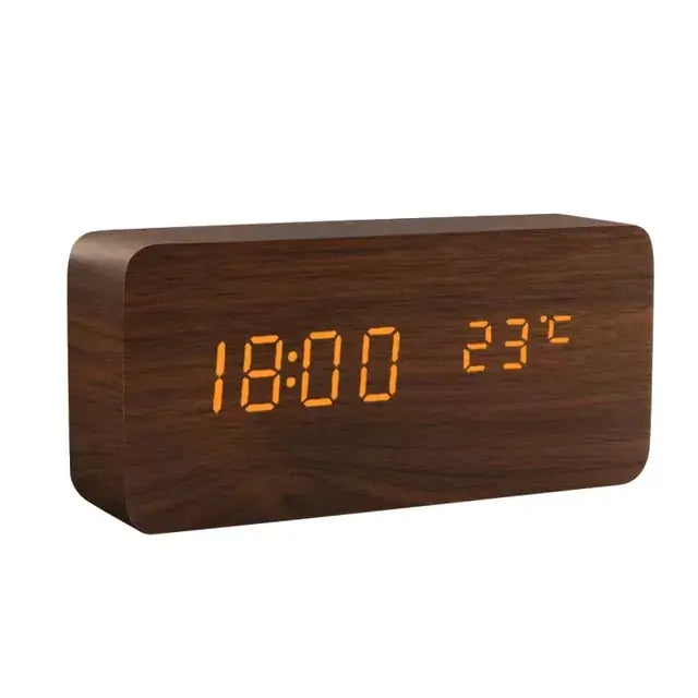a wooden clock with yellow numbers on it