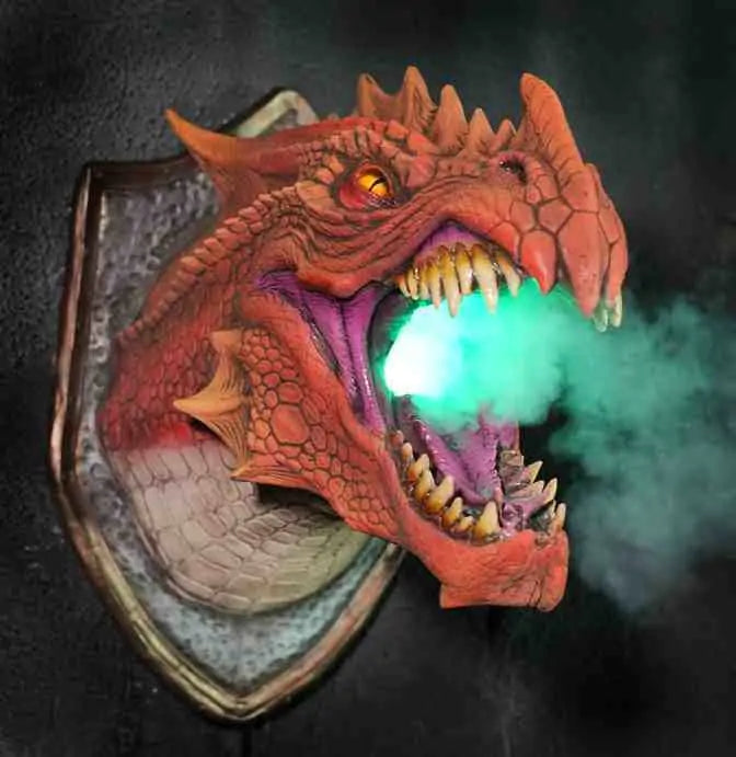 a red dragon head with green smoke coming out of it