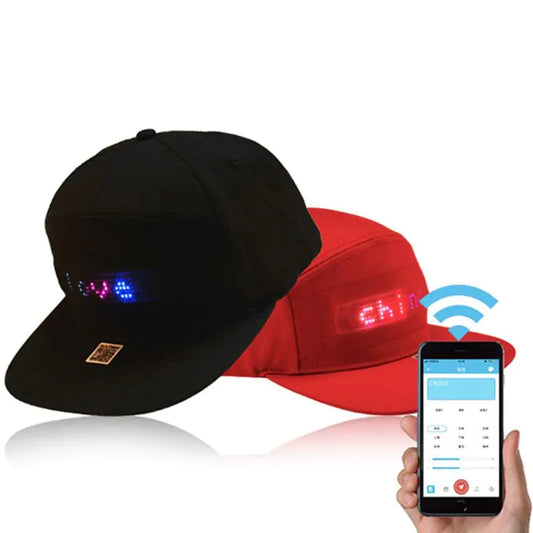 a person holding a smart phone next to two hats
