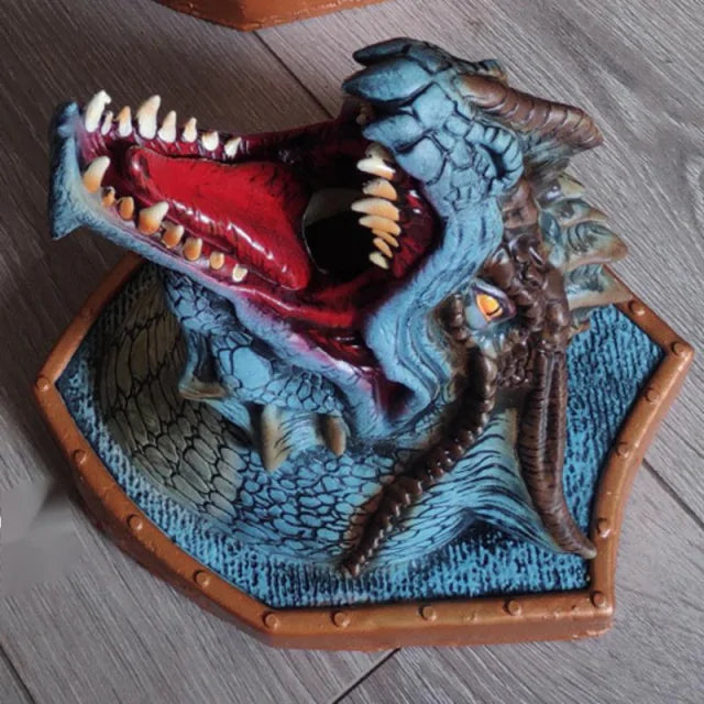 a blue dragon figurine with its mouth open