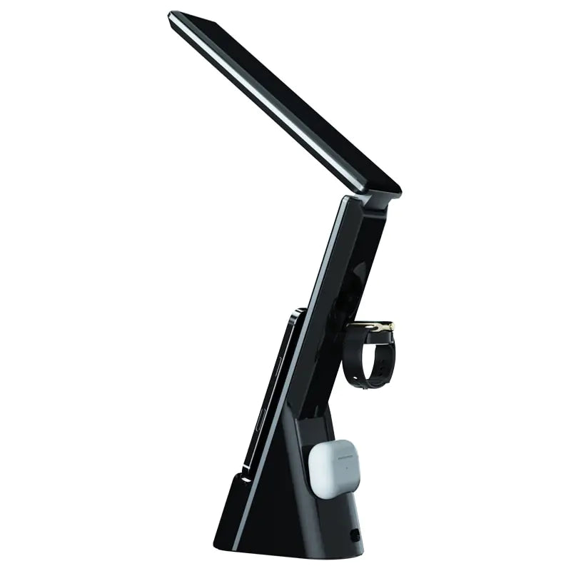 a desk lamp with a cell phone on it