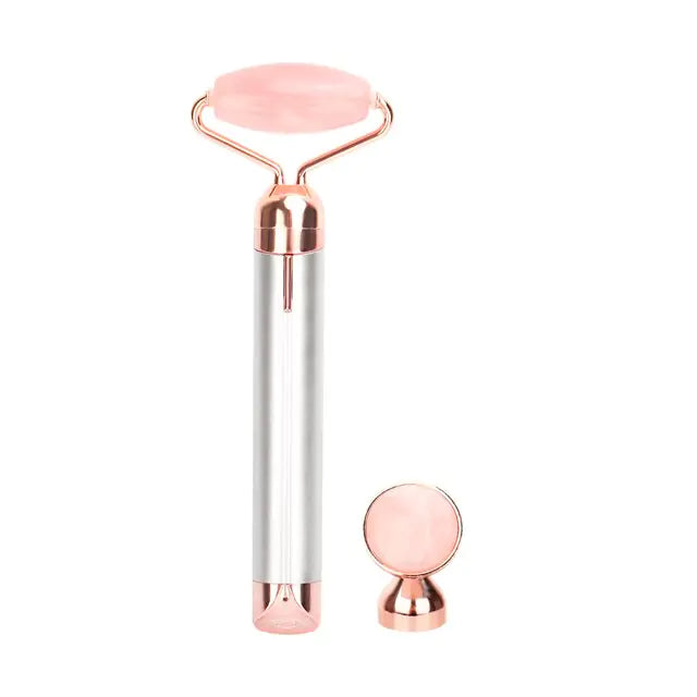a pink glass roller with a metal handle
