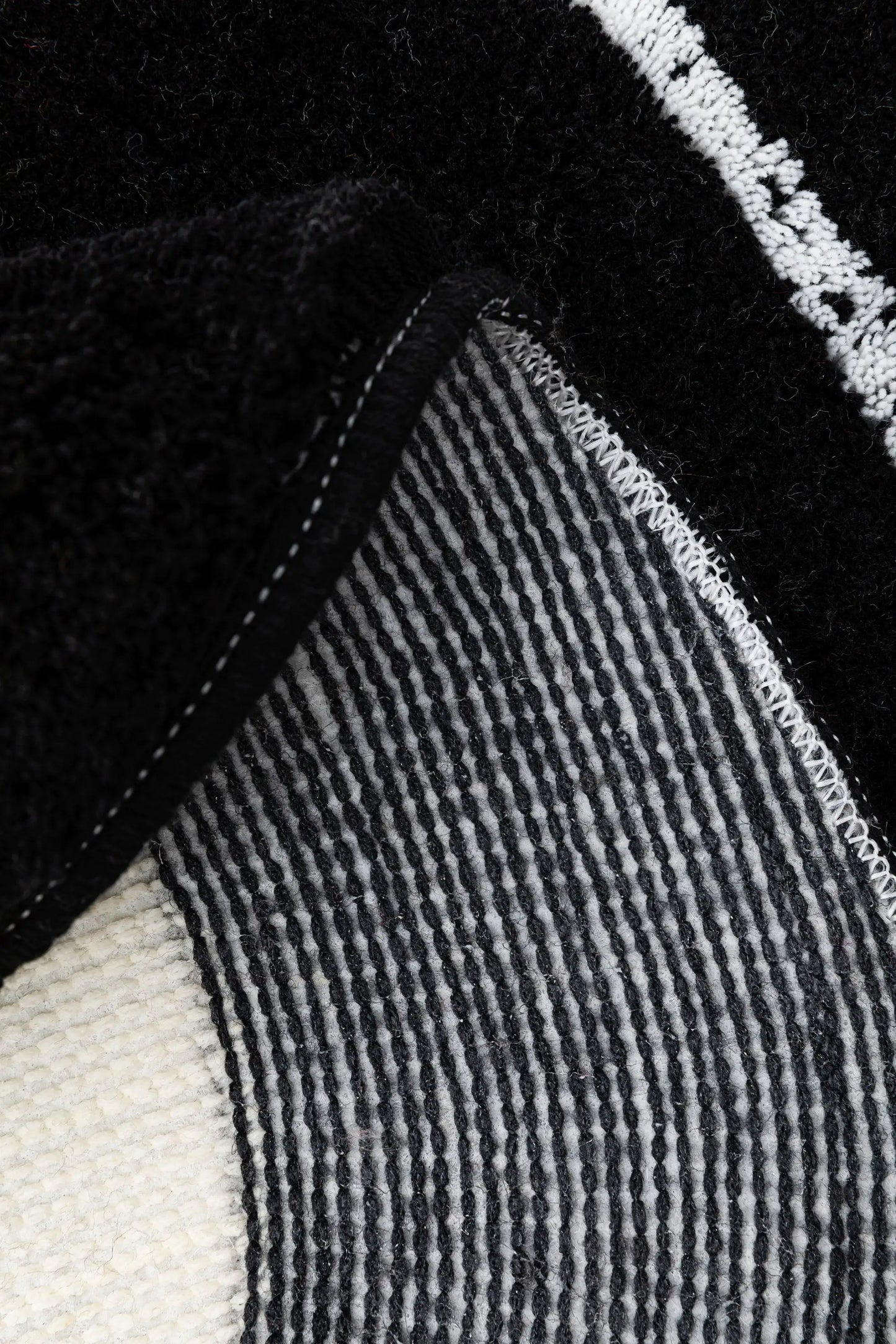 a close up of a black and white sweater