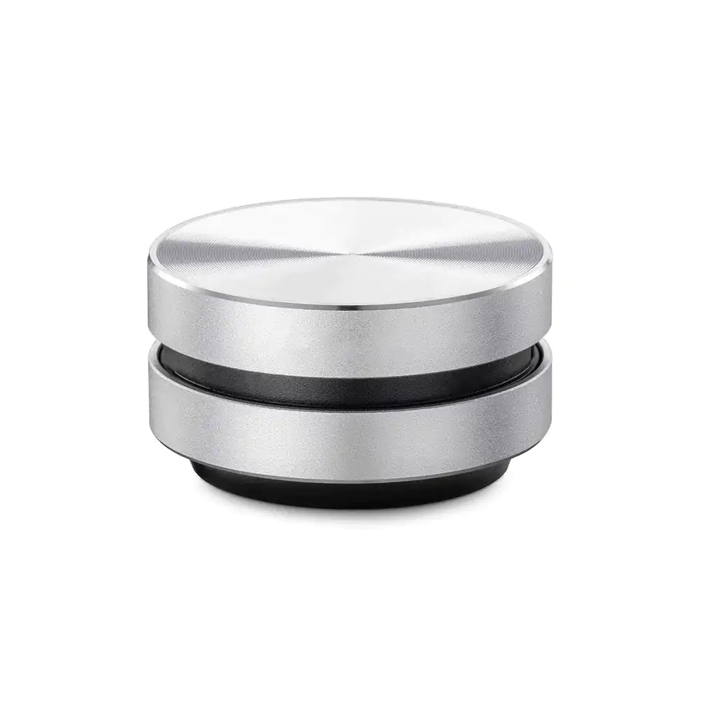 a silver and black object on a white background