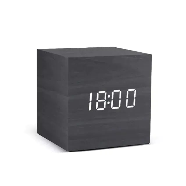 a wooden block with a digital clock on it