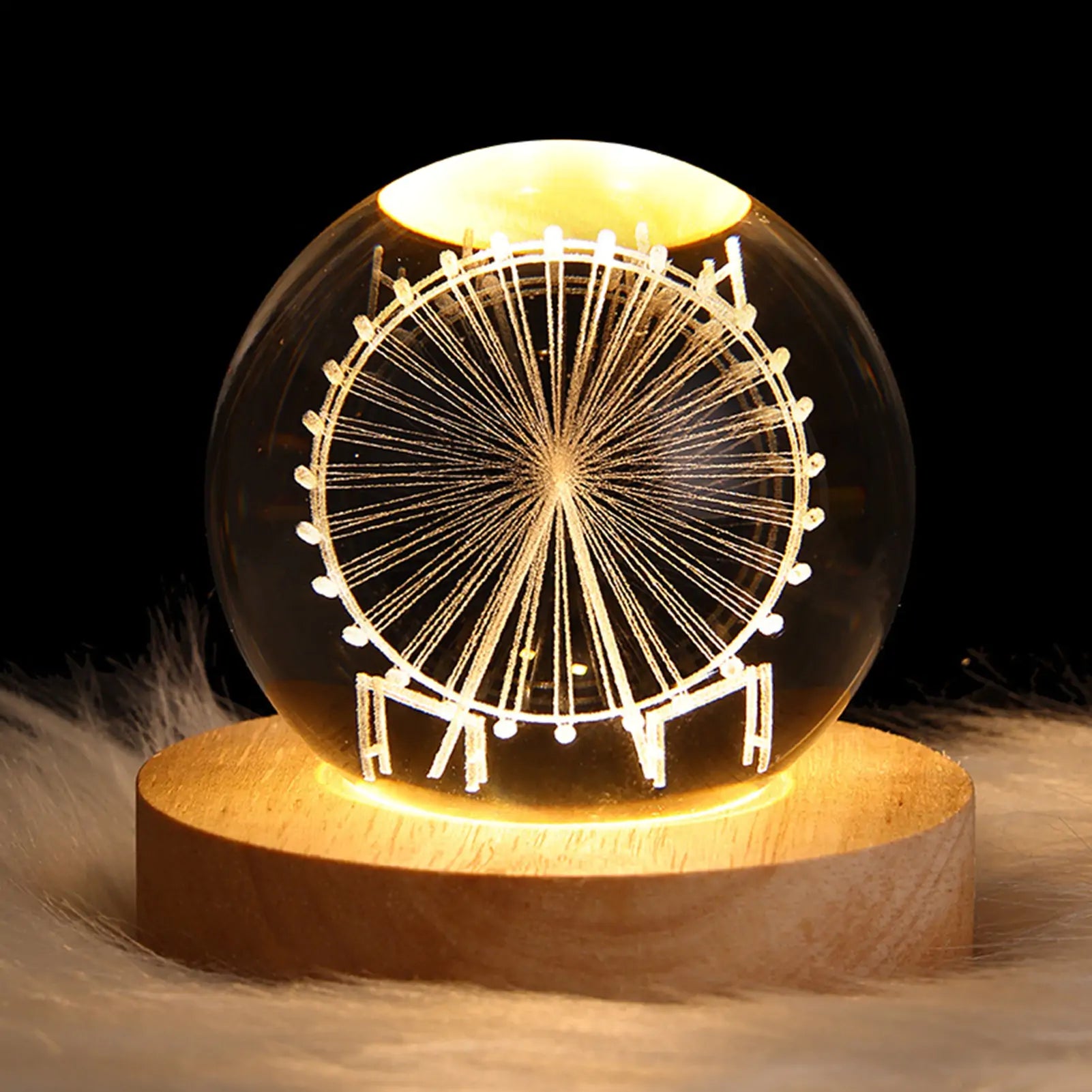 a glass ball with a ferris wheel inside of it