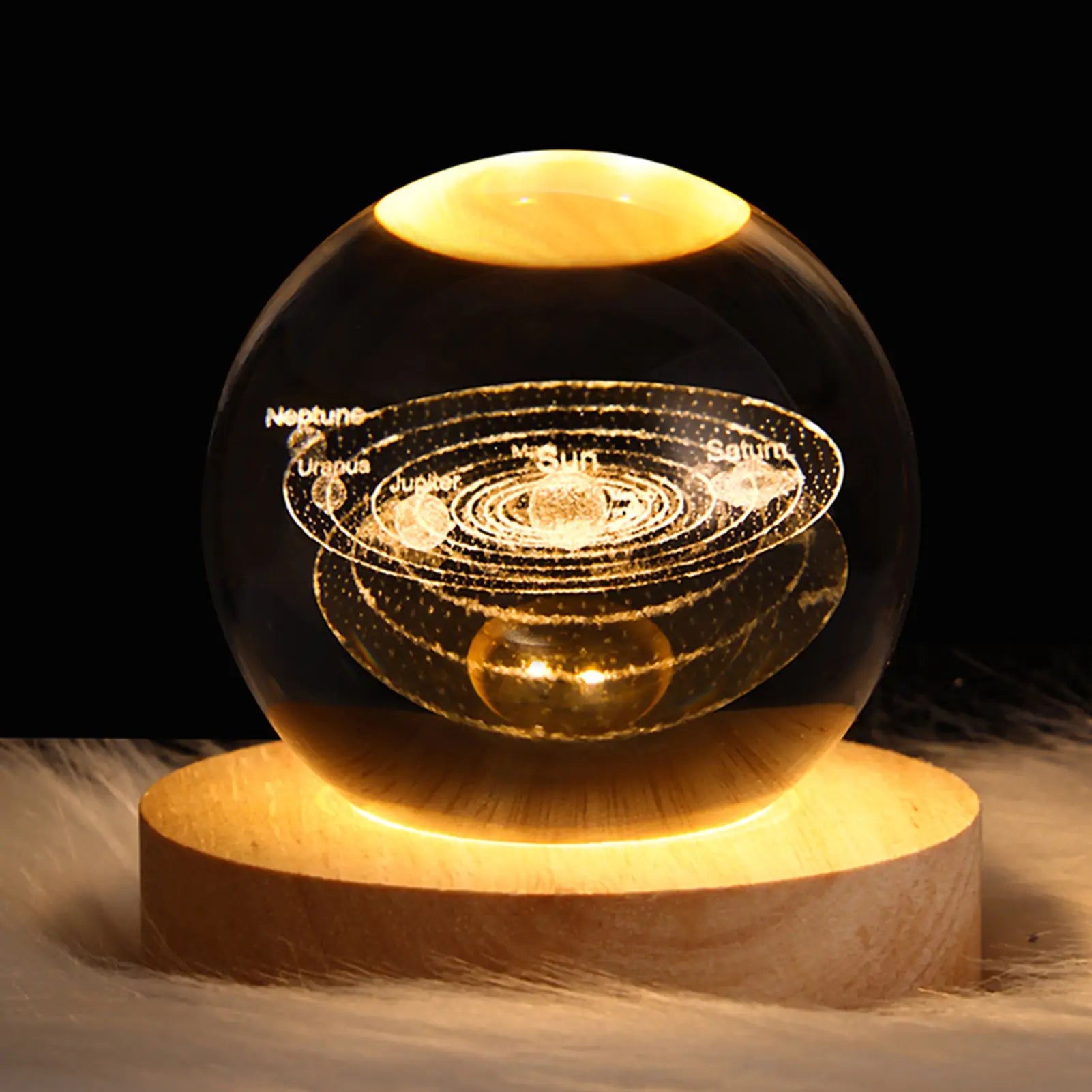 a glass ball sitting on top of a wooden stand