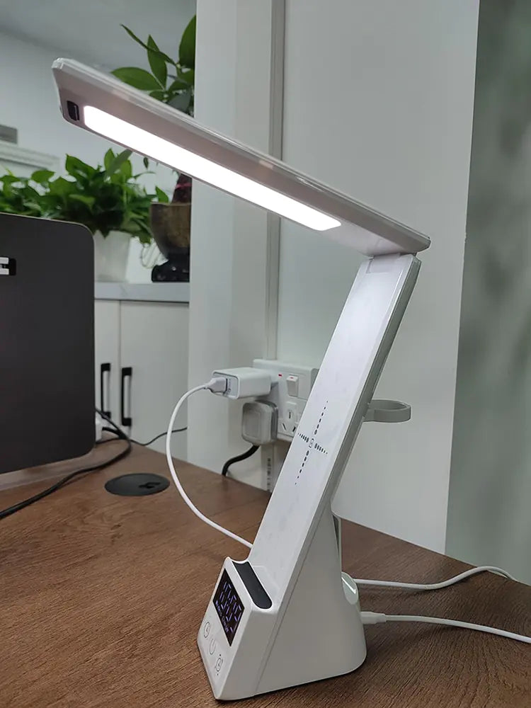 a desk lamp sitting on top of a wooden table