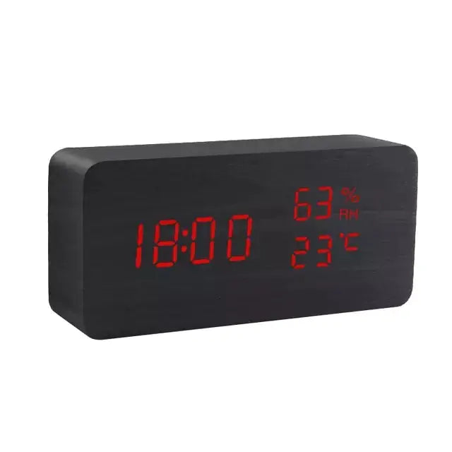 a black clock with red numbers on it