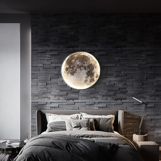 a bedroom with a bed and a large moon on the wall