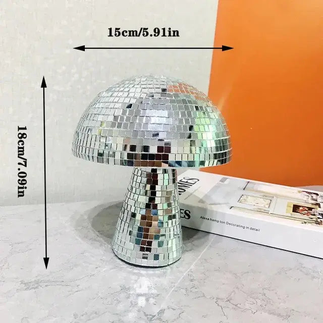 a disco ball lamp sitting on top of a table