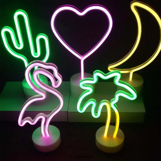 a couple of neon signs sitting on top of a table