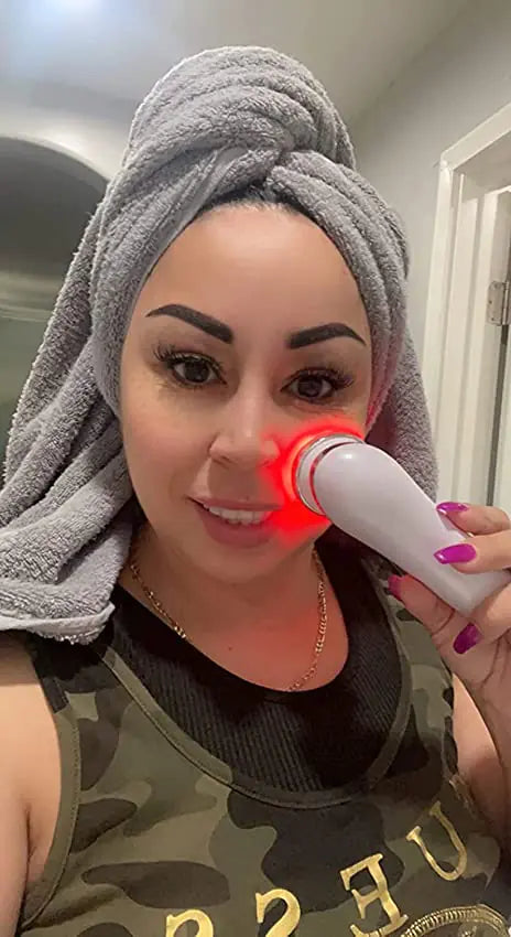 a woman with a towel on her head brushing her teeth