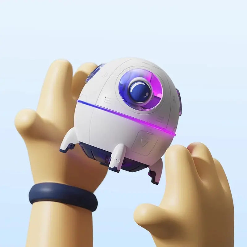 a hand holding a small white object with a purple light on it