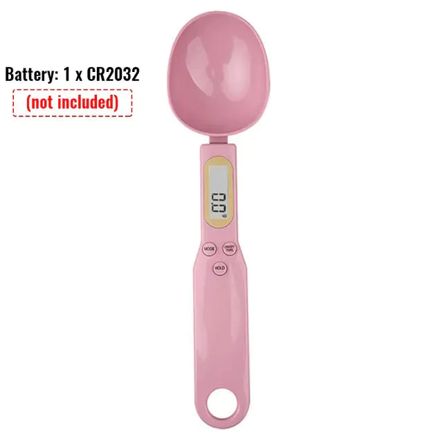 a pink electric toothbrush with a light on top of it