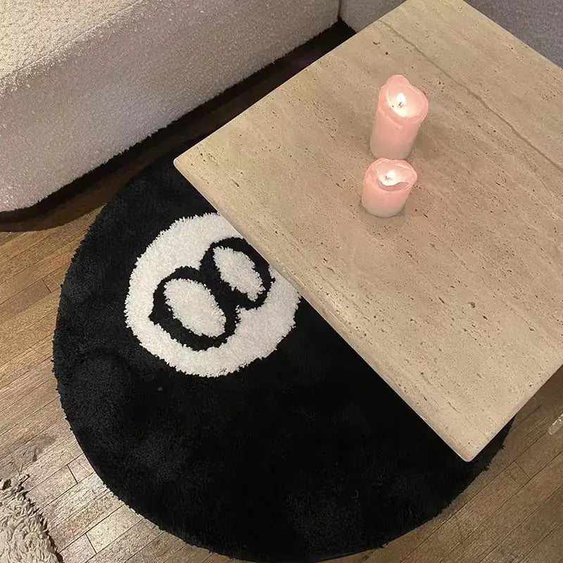 a coffee table with a candle on top of it