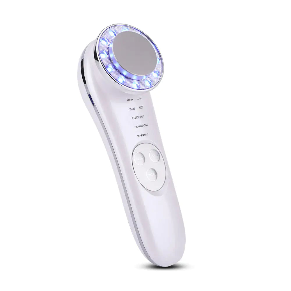 a white electric toothbrush with a blue light on it