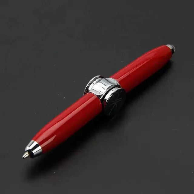 a red pen sitting on top of a black table