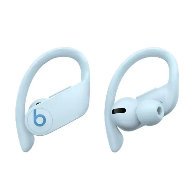 a pair of blue earphones sitting next to each other
