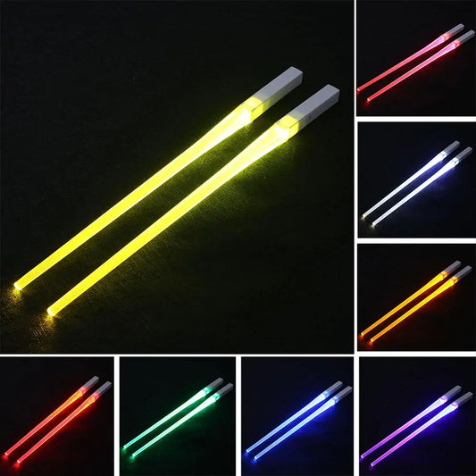 four different colors of light sabers on a black background