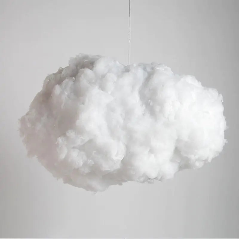 a white cloud hanging from a string