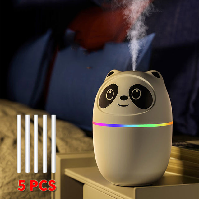 a panda humider sitting on top of a nightstand