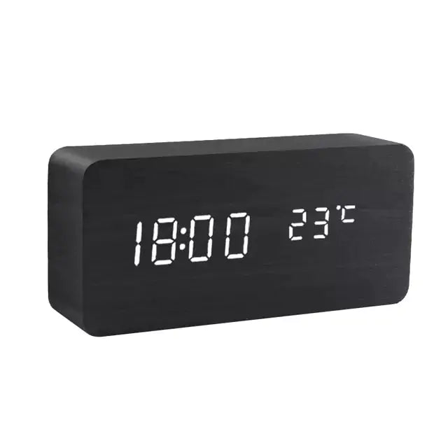 a black clock with white numbers on it