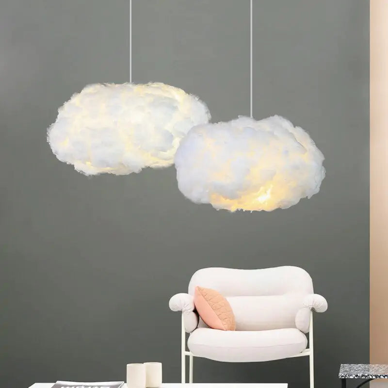 a living room with two clouds hanging from the ceiling