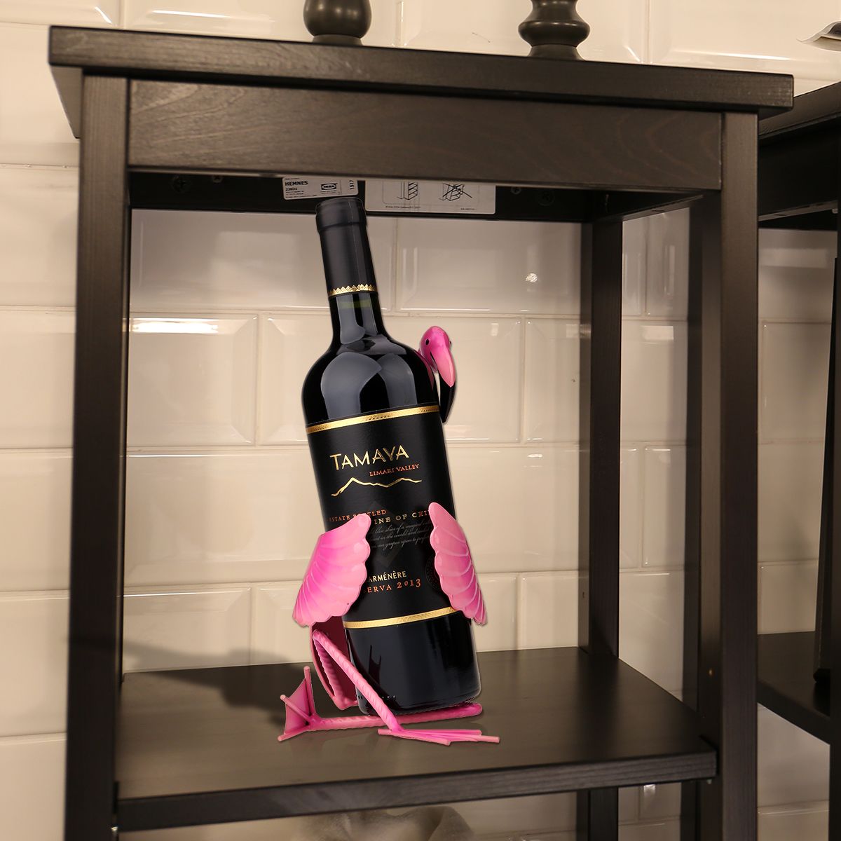 a bottle of wine sitting on top of a shelf