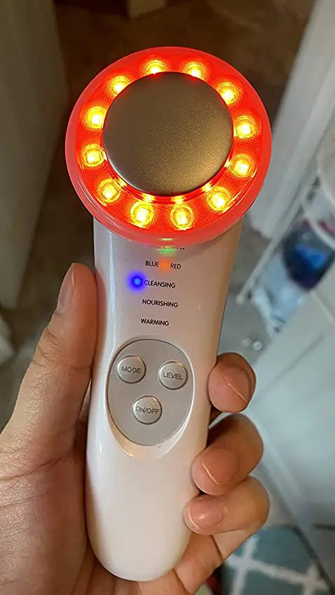 a person holding a white and red light up device