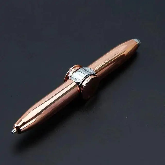 a rose gold fountain pen on a black surface