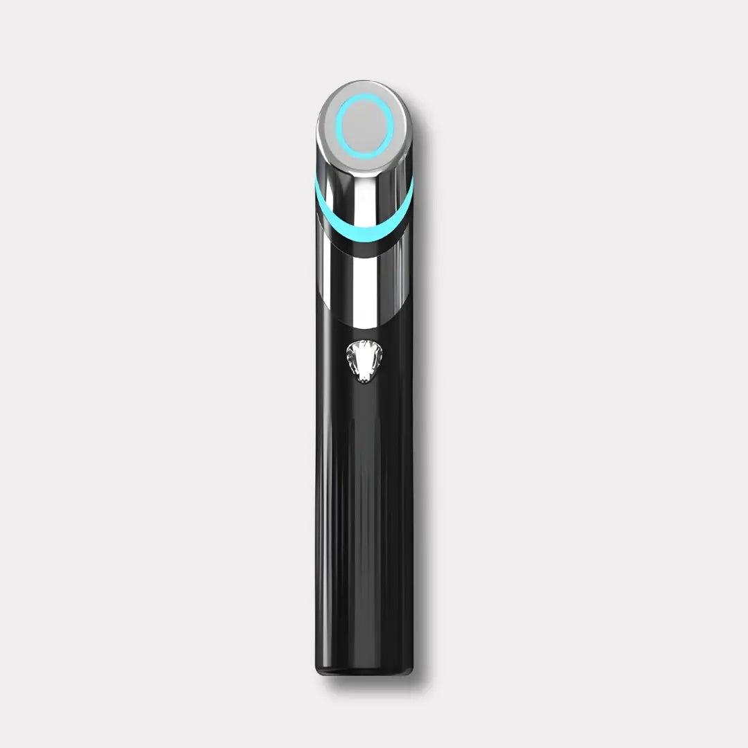 a black electric toothbrush with a blue light on it
